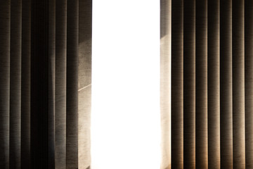 light in window with curtains