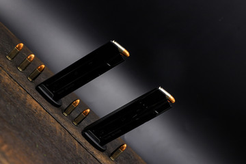 9 mm ammunition on a black background - obrazy, fototapety, plakaty