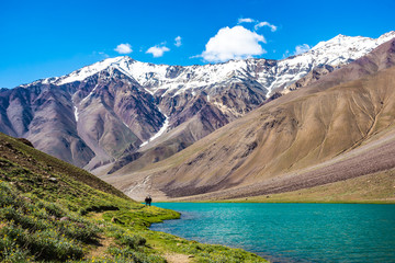 Landscape showing himalayan mountains and the turquoise lake called Chandra Tal, at the Sipti...