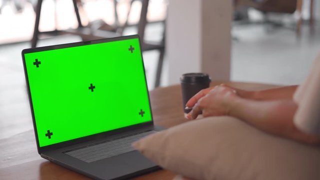 Isolated Green Screen laptop and woman hands writing notes from video lessons webinar
