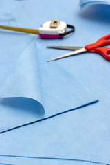 A tools for a making face masks from sterilization wrapping paper, close up. A homemade produce of...