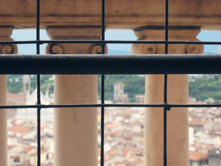 Coronavirus lockdown quarantine in Italy concept. Florence panorama behind metal bars. View from the top of Duomo Cathedral