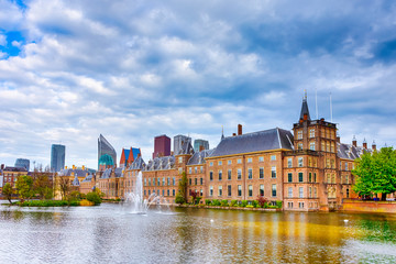 Fototapeta na wymiar Binnenhof Palace of Parliament inThe Hague in The Netherlands At Daytime. Against Modern Skyscrapers on Background.