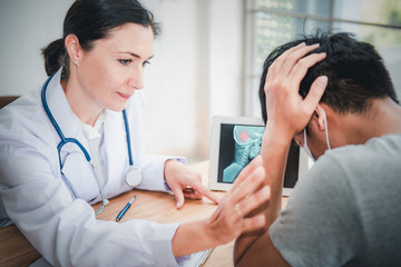 Medical Doctor is Encouraging and Health Care Consultation to Patient in Examination Room, Female Medicine Doctor Giving Encouragement and Consulting Health Problem to Male Patient. Encourage Concept