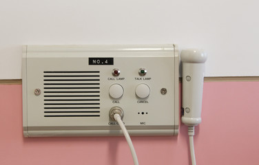 Intercom for nurse calls and light switches on the wall In the hospital's patient room to accommodate medical devices.