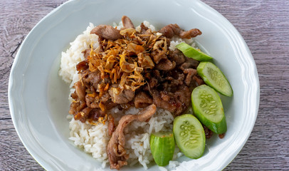 Pork fried in garlic on rice 