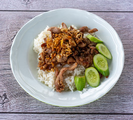 Pork fried in garlic on rice 