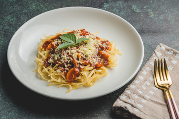 Cheesy and Meaty Linguine Spaghetti topped with Basil Leaves-Center with Gold Pink Fancy Forks