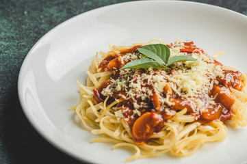 Cheesy and Meaty Linguine Spaghetti topped with Basil Leaves-Close up Side without Fork