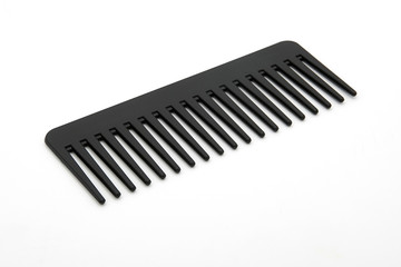 black hairbrush isolated on a wight background