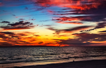 Fototapeta na wymiar sunset over the sea, red, cloudscape, sky, sea, water, evening, waves, ocean, beautiful, coast, Siesta Key, Florida
