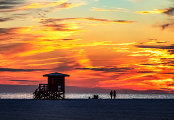 sunset on the beach, sea, sky, water, ocean, beach, clouds, lifeguard, silhouette, tower, evening, orange, yellow, Siesta Key, Florida