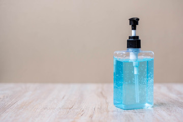 wash hand alcohol gel or sanitizer bottle on wooden table background, prevent coronavirus or Corona Virus Disease. Disinfectant, Antiseptic, personal hygiene, new normal and Health concept