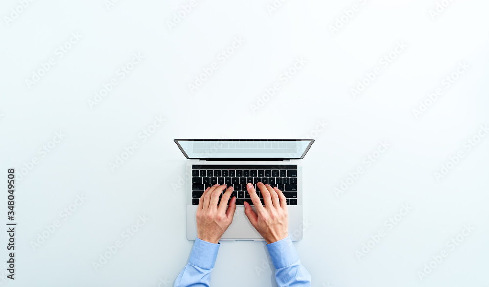 Aufkleber Top view of laptop. Businessman using laptop. Blank display. White background.