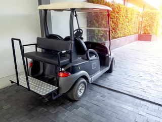 Black golf cart or golf buggy car in the hotel.