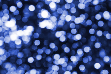 Naklejka na ściany i meble Abstract bright blue blurred bokeh background close up, defocused round blue and white lights texture, beautiful shiny glowing pattern, holiday decorative backdrop, festive sparkling wallpaper design
