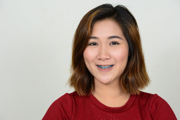 Portrait of young Asian woman with short hair