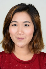 Portrait of young Asian woman with short hair