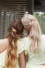 Fototapeta premium Stylish hairstyles of bridesmaids. Fashionable hairstyles with jewelry