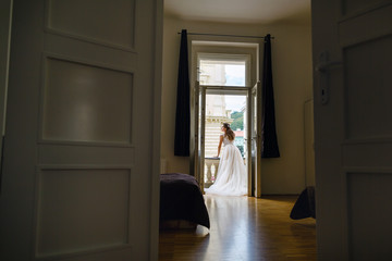 Fototapeta na wymiar morning of the bride. bride on the balcony in the morning.