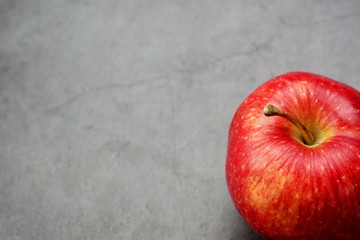 Red apple on a dark background