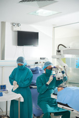 Team of surgeons getting ready for eye surgery or vision restoration procedure