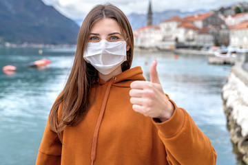 Lockdown is over concept. Woman in mask can travel safe. We back to normal life. Coronavirus ended.