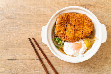Japanese fried pork cutlet (katsudon) with onion soup and egg