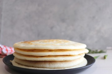 Soft & Spongy Malvani Amboli. It is a typical Konkani preparation made with rice and Urad dal or black lentil  fermented batter. Soft Dosa or plain uttapam. Best to combine with fish curry. Copy Space