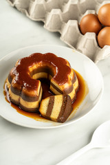 sweetened caramel pudding layered with chocolate taste