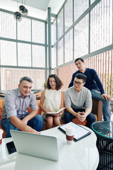 Mature entrepreneur showing project presentation to his team at meeting
