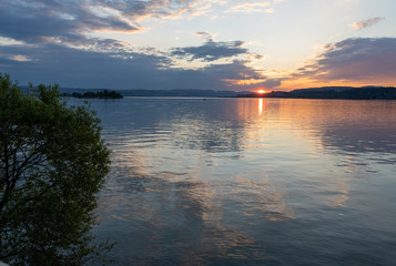 Stunning sunset on the shores of the Upper Zurich Lake (Obersee), near Rapperswil, St. Gallen, Switzerland