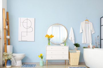 Interior of bathroom with fresh flowers