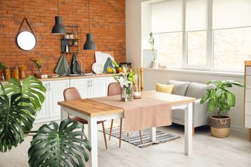 Interior of modern stylish dining room with floral decor