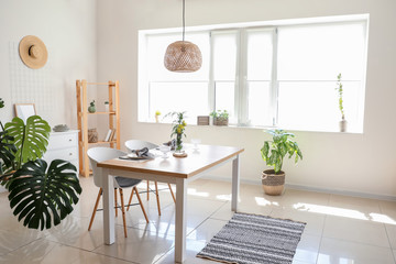 Interior of modern stylish dining room with floral decor