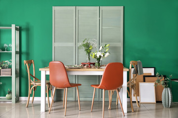 Interior of modern stylish dining room with floral decor