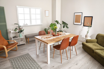 Interior of modern stylish dining room with floral decor