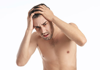 Young man with anorexia on white background