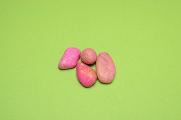 Pebbles on green background