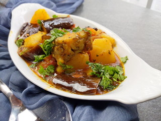 Top down view of a plate of Gluten free and vegan Eggplant and Potato curry or fry