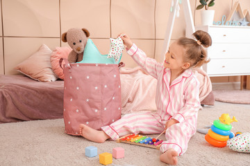 Little girl playing at home