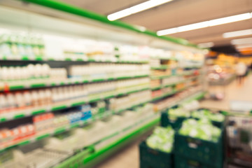 Wood top table on blur supermarket background