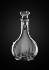 Empty decanter on dark background