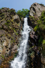 Rocky mountains waterfall in the afternoon short exposure flash