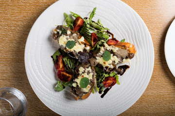 Crostini with sautéed forest mushrooms, garlic, basil and mozzarella.Traditional italian antipasti appetizer