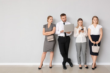 Business people waiting in line indoors