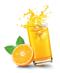 Glass of splashing orange juice with orange fruit on white background