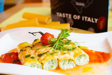 Cannelloni pasta tubes are stuffed with a rich and flavorful ricotta filling, then covered marinara