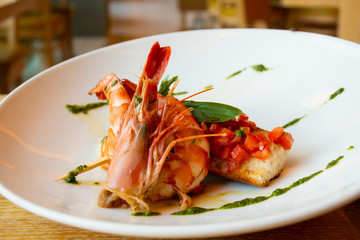 Shrimp, bruschetta with tomatoes, garlic and fresh basil