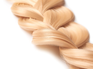 Beautiful braided blonde hair on white background, closeup